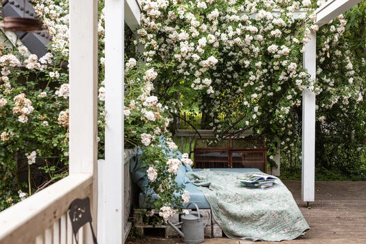 Woman in armchair in garden